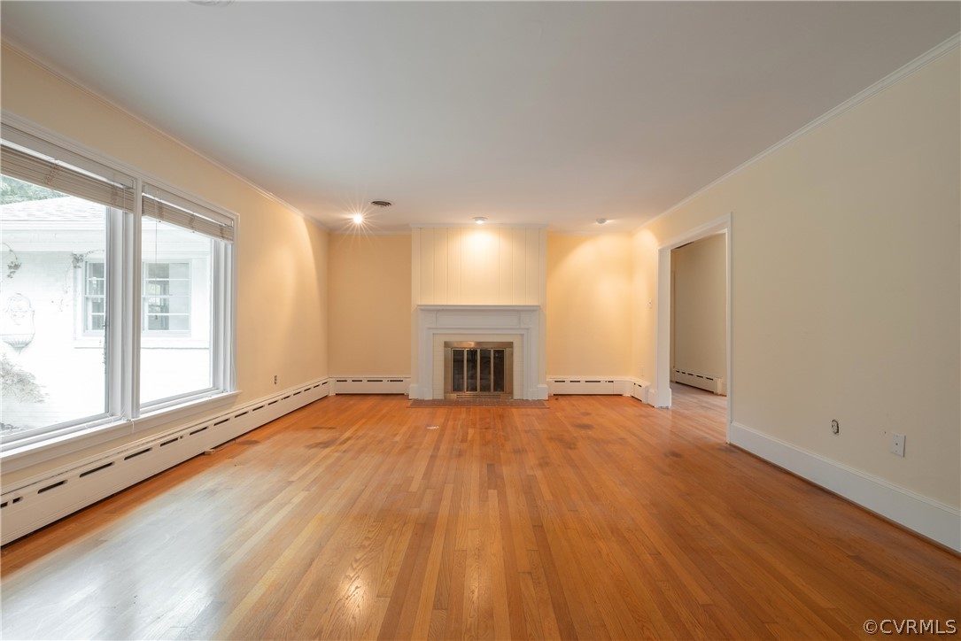 8401 Halesworth Road Richmond, VA 23235 - Photo 39 of 50 a view of an empty room with a window and wooden floor