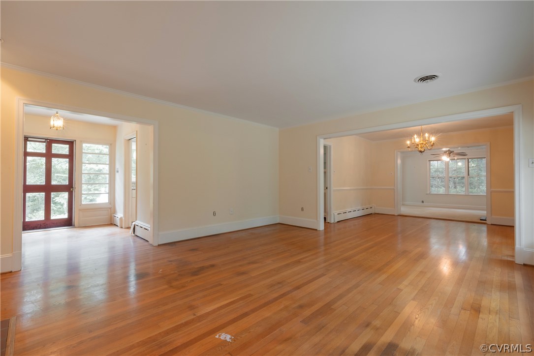 8401 Halesworth Road Richmond, VA 23235 - Photo 41 of 50 an empty room with wooden floor and windows