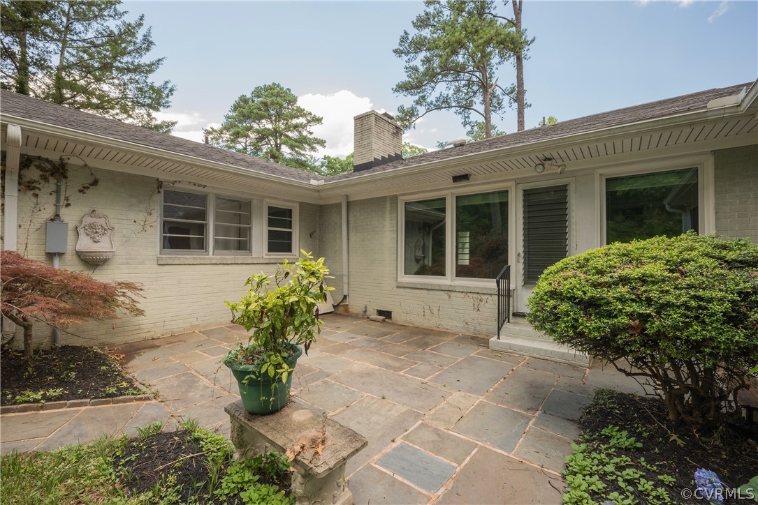 8401 Halesworth Road Richmond, VA 23235 - Photo 46 of 50 a front view of a house with garden