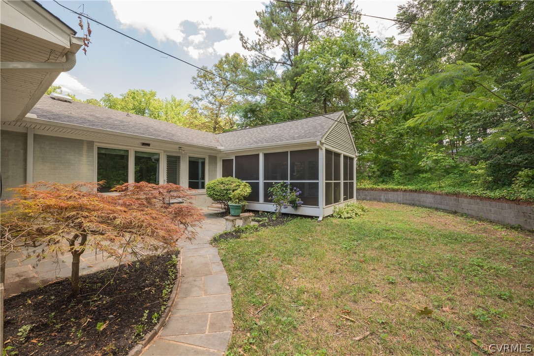 8401 Halesworth Road Richmond, VA 23235 - Photo 47 of 50 a view of a house with backyard sitting area and garden