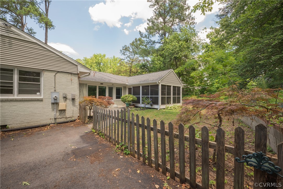 8401 Halesworth Road Richmond, VA 23235 - Photo 48 of 50 a front view of a house with a yard