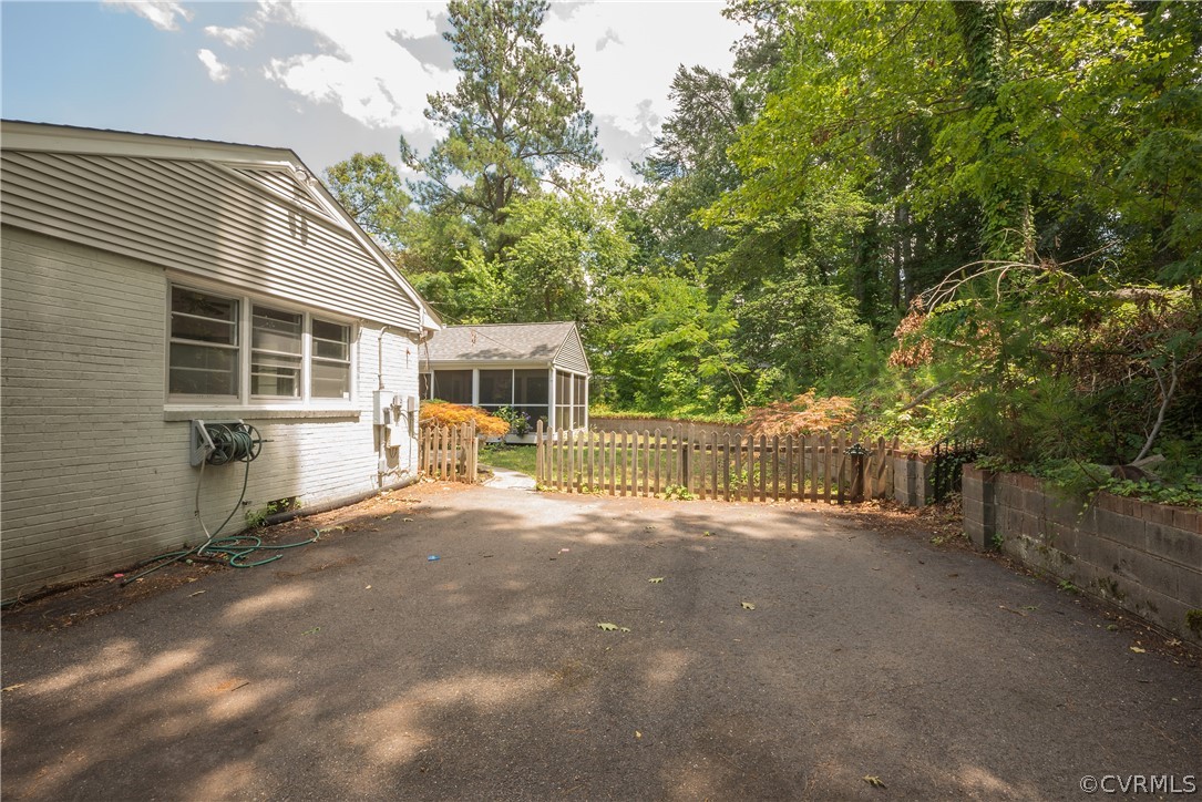 8401 Halesworth Road Richmond, VA 23235 - Photo 49 of 50 a view of a house with a backyard and a tree