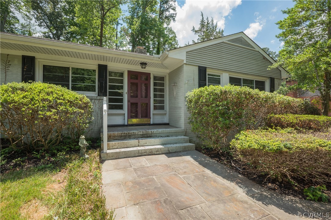 8401 Halesworth Road Richmond, VA 23235 - Photo 6 of 50 a front view of a house with garden