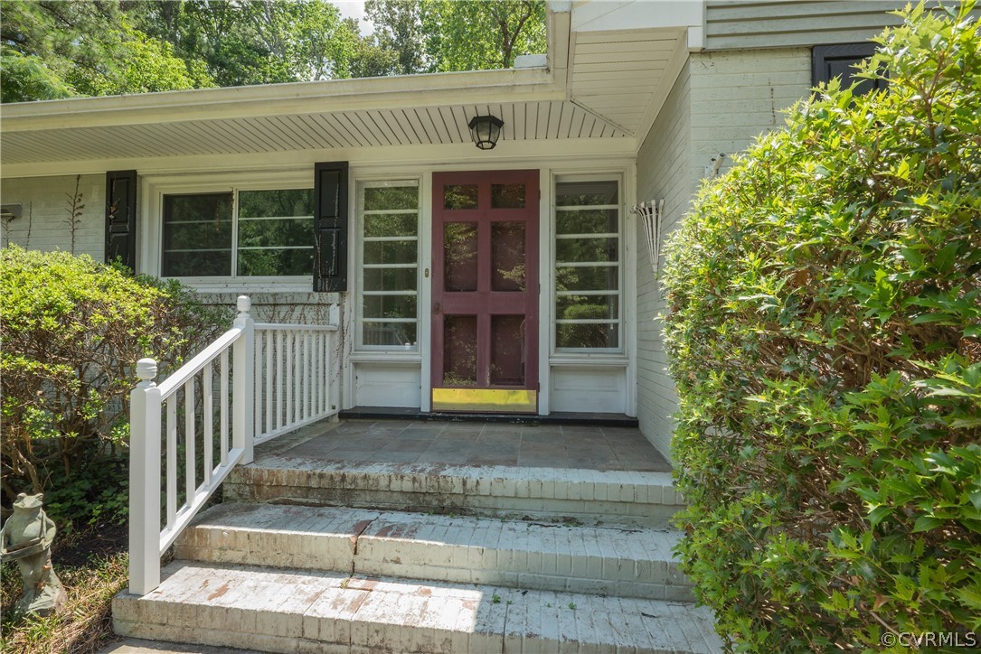 8401 Halesworth Road Richmond, VA 23235 - Photo 7 of 50 a front view of a house with a yard