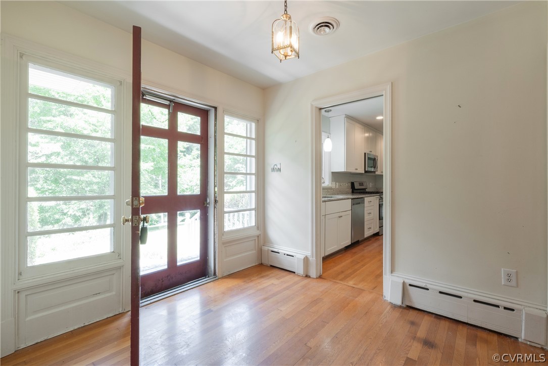 8401 Halesworth Road Richmond, VA 23235 - Photo 9 of 50 wooden floor in an empty room with a window