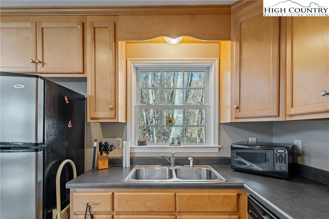 130 Alexander Drive Boone, NC 28607 - Photo 11 of 48 a kitchen with a window a sink and a window