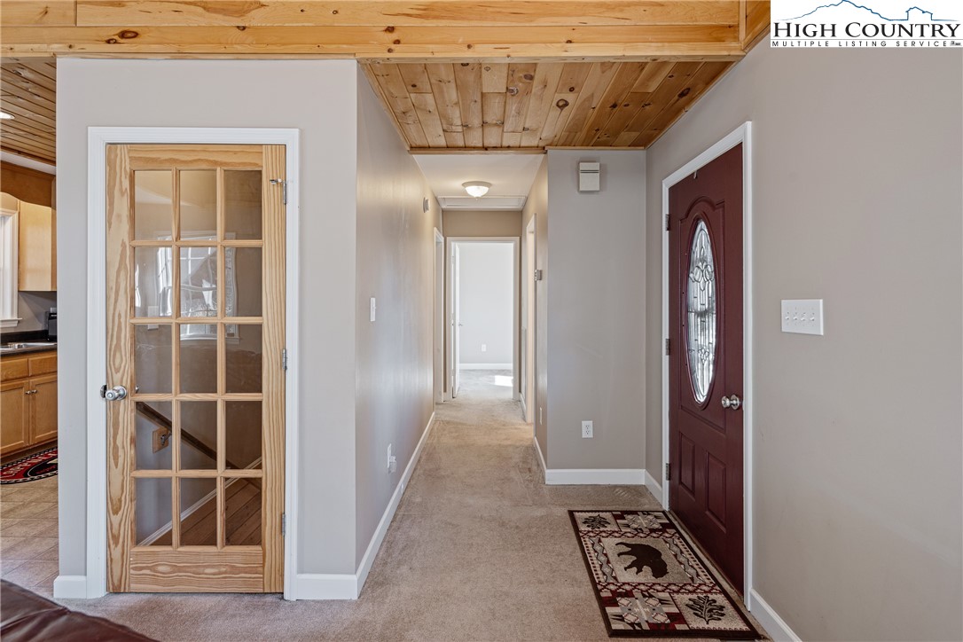 130 Alexander Drive Boone, NC 28607 - Photo 12 of 48 a view of a hallway with wooden shelves