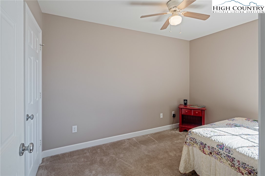 130 Alexander Drive Boone, NC 28607 - Photo 13 of 48 a bedroom with a bed and cabinets