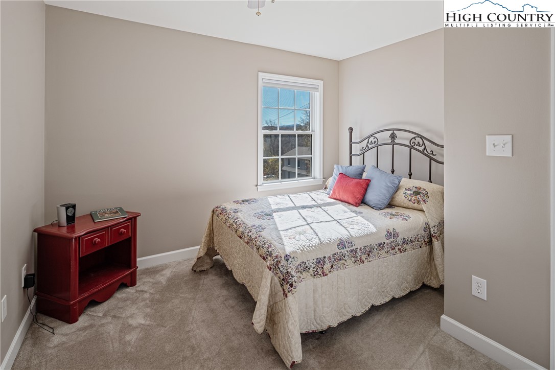 130 Alexander Drive Boone, NC 28607 - Photo 14 of 48 a bedroom with a bed and a window