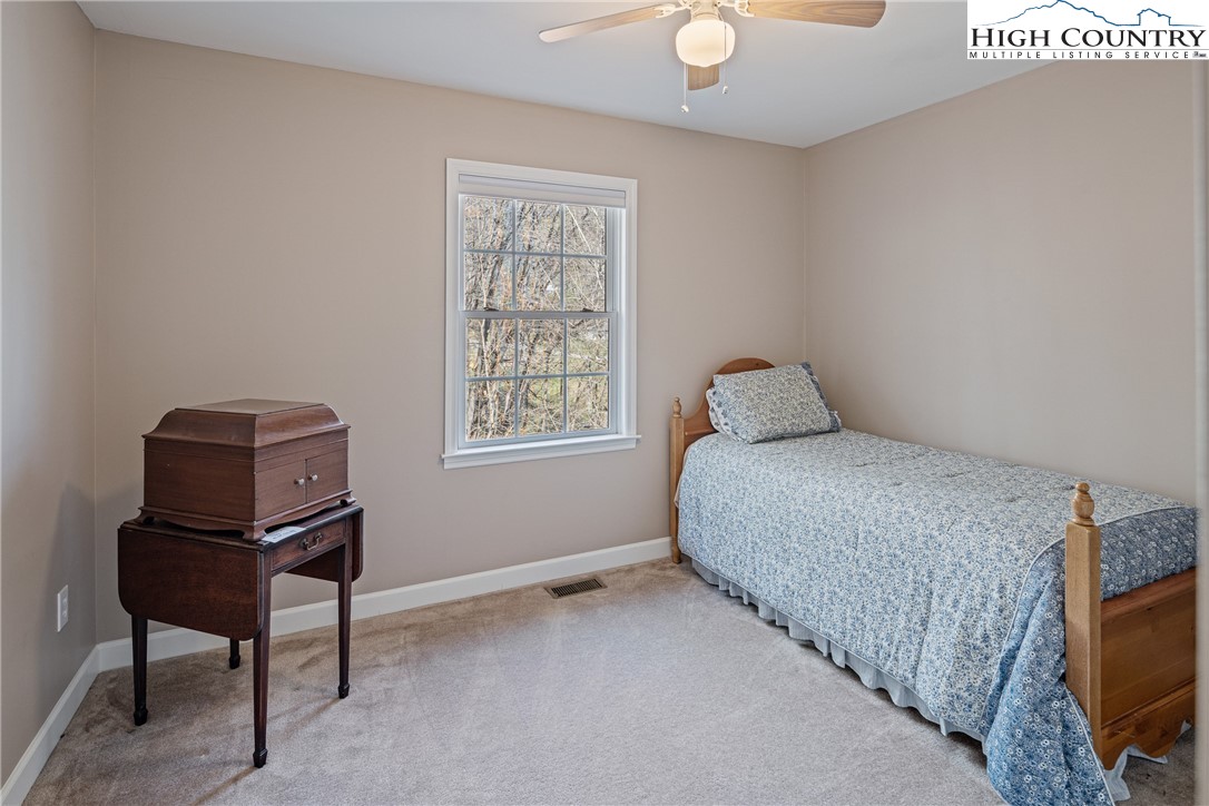 130 Alexander Drive Boone, NC 28607 - Photo 16 of 48 a bedroom with a bed and a window