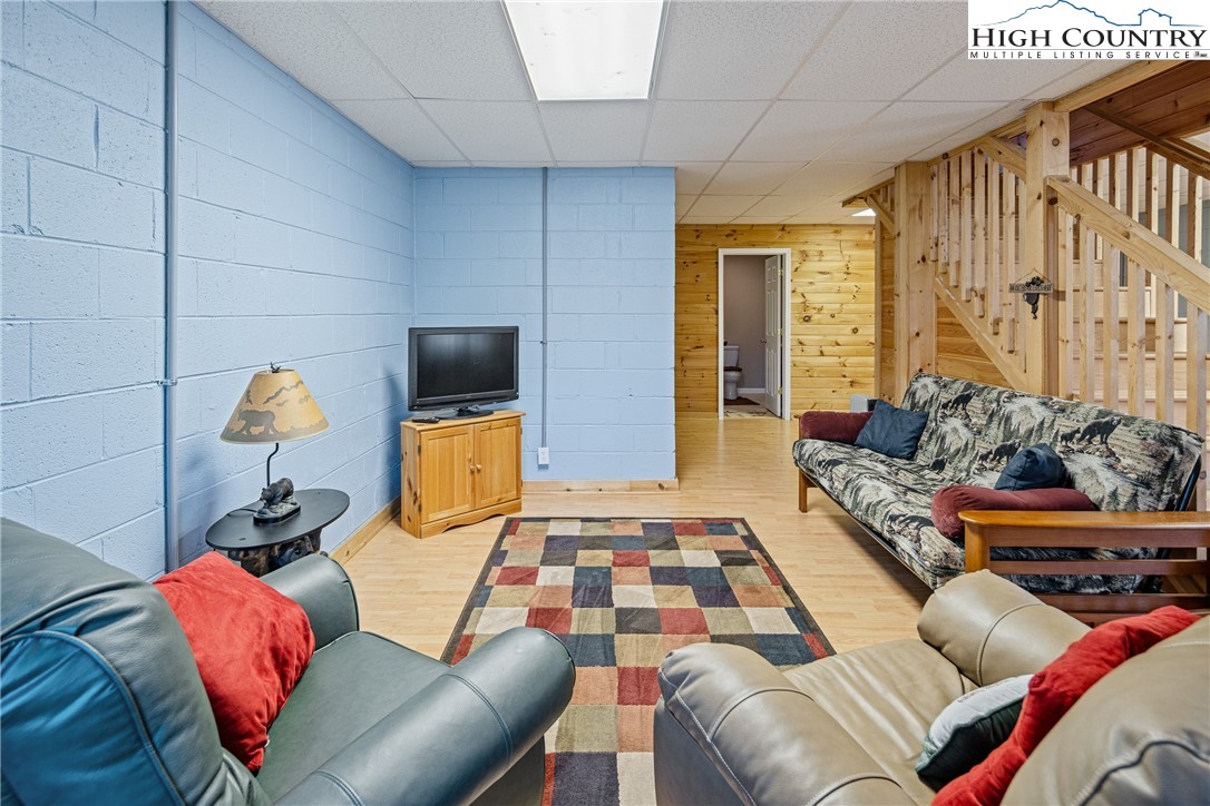130 Alexander Drive Boone, NC 28607 - Photo 21 of 48 a living room with furniture and a flat screen tv