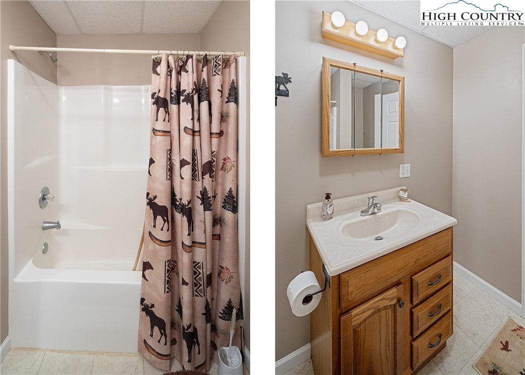 130 Alexander Drive Boone, NC 28607 - Photo 29 of 48 a bathroom with a sink and mirror with shower