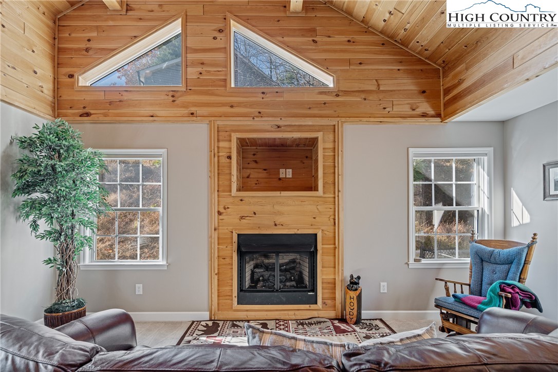 130 Alexander Drive Boone, NC 28607 - Photo 3 of 48 a living room with furniture and a potted plant