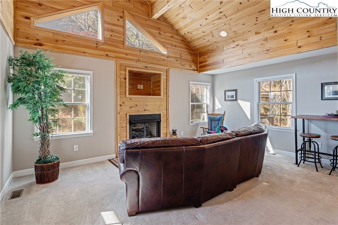 130 Alexander Drive Boone, NC 28607 - Photo 4 of 48 a living room with furniture and a fireplace