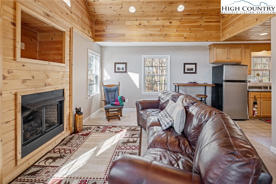130 Alexander Drive Boone, NC 28607 - Photo 5 of 48 a living room with furniture and a fireplace