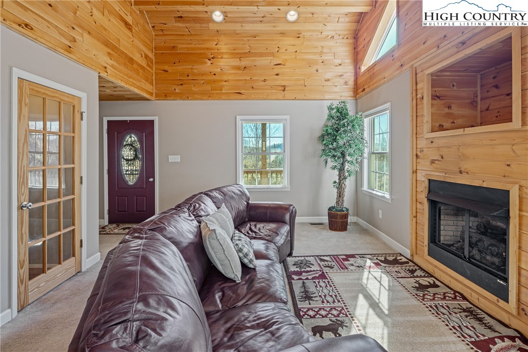 130 Alexander Drive Boone, NC 28607 - Photo 7 of 48 a living room with furniture and a fireplace