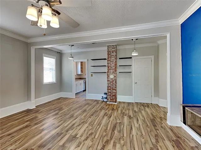 a view of a livingroom with wooden floor