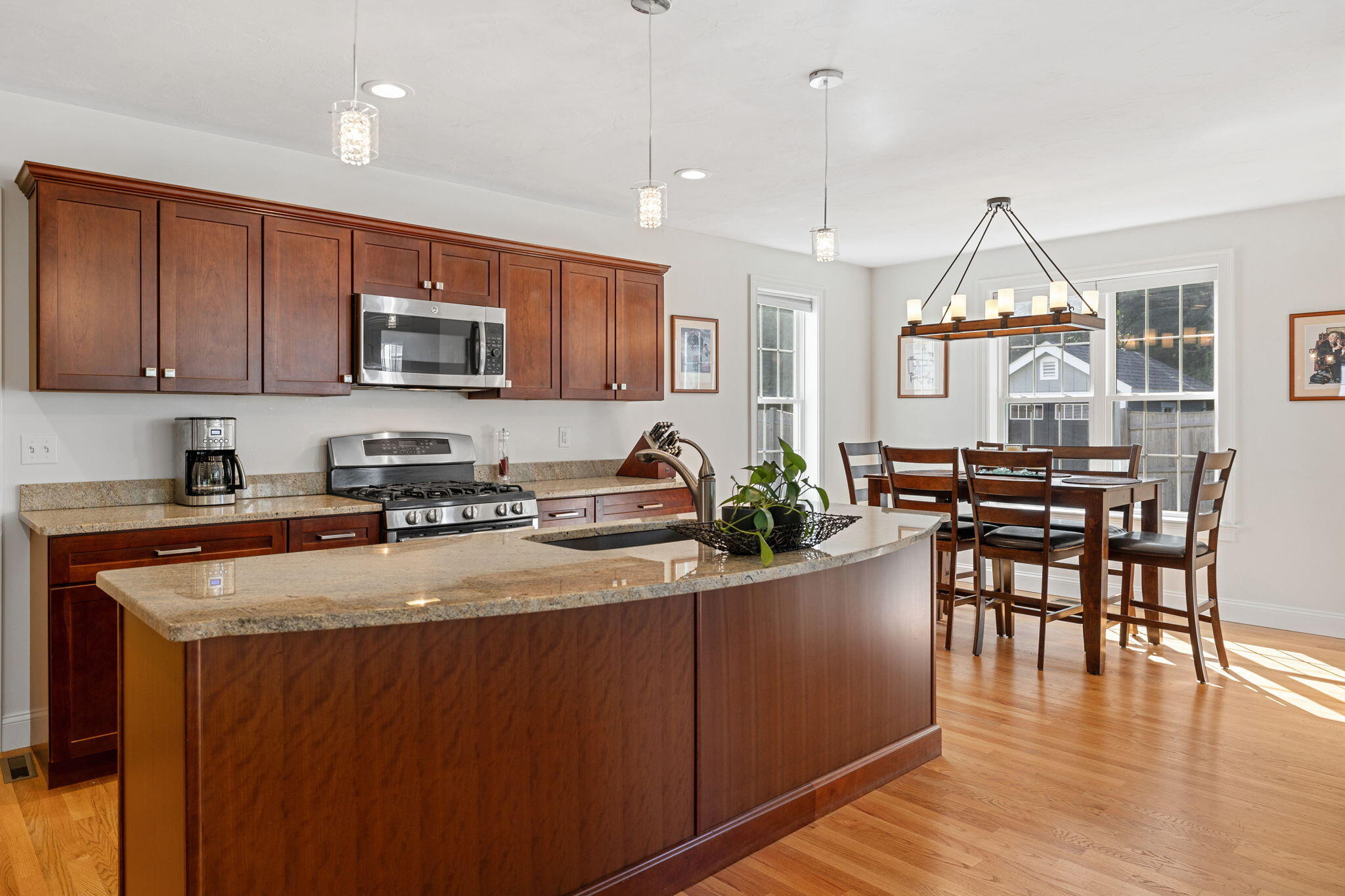 48 Meadowbrook Road Mashpee, MA 02649 - Photo 11 of 52 a kitchen with sink a microwave and cabinets