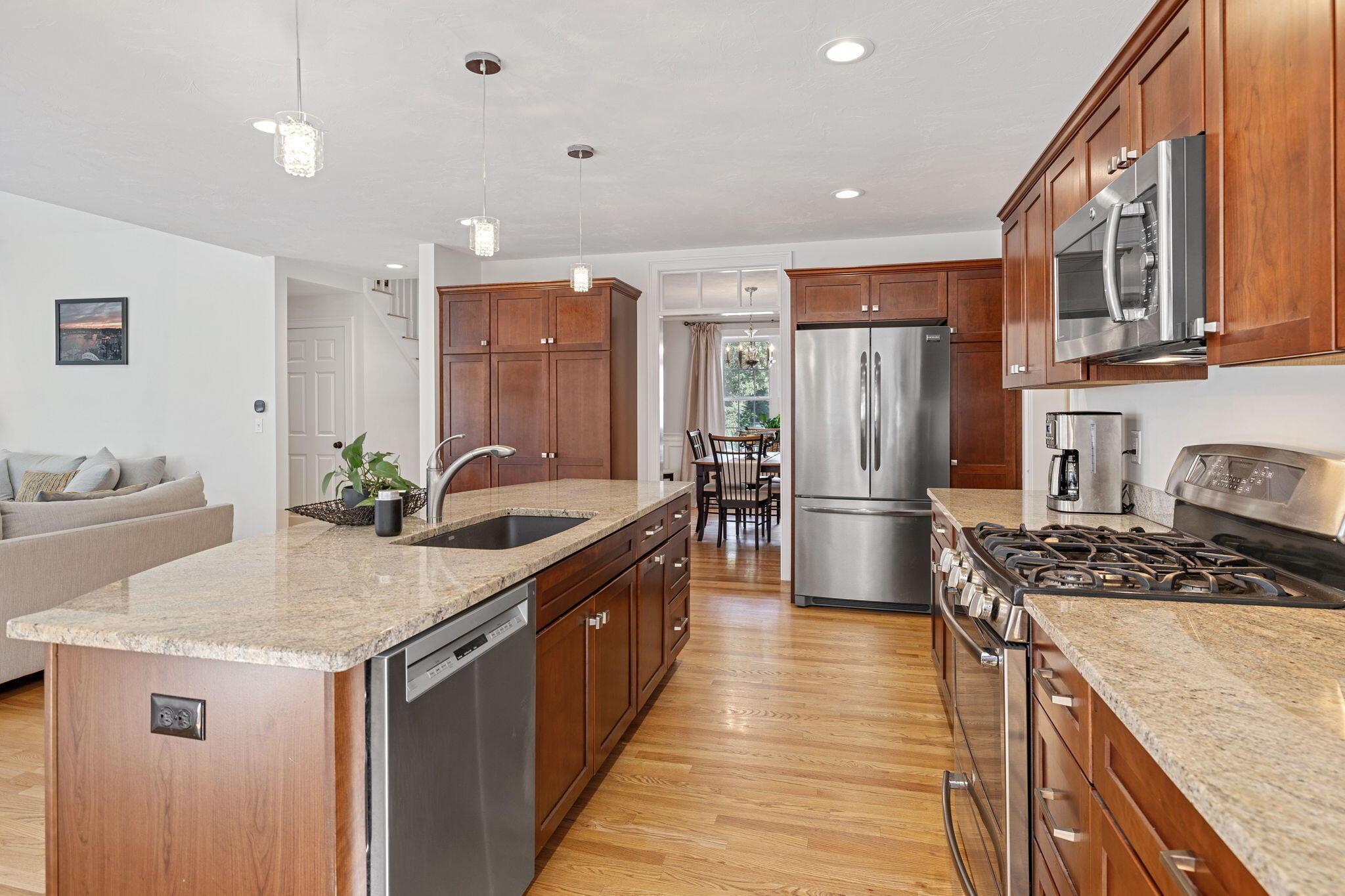 48 Meadowbrook Road Mashpee, MA 02649 - Photo 18 of 52 a kitchen with stainless steel appliances granite countertop a sink stove and refrigerator