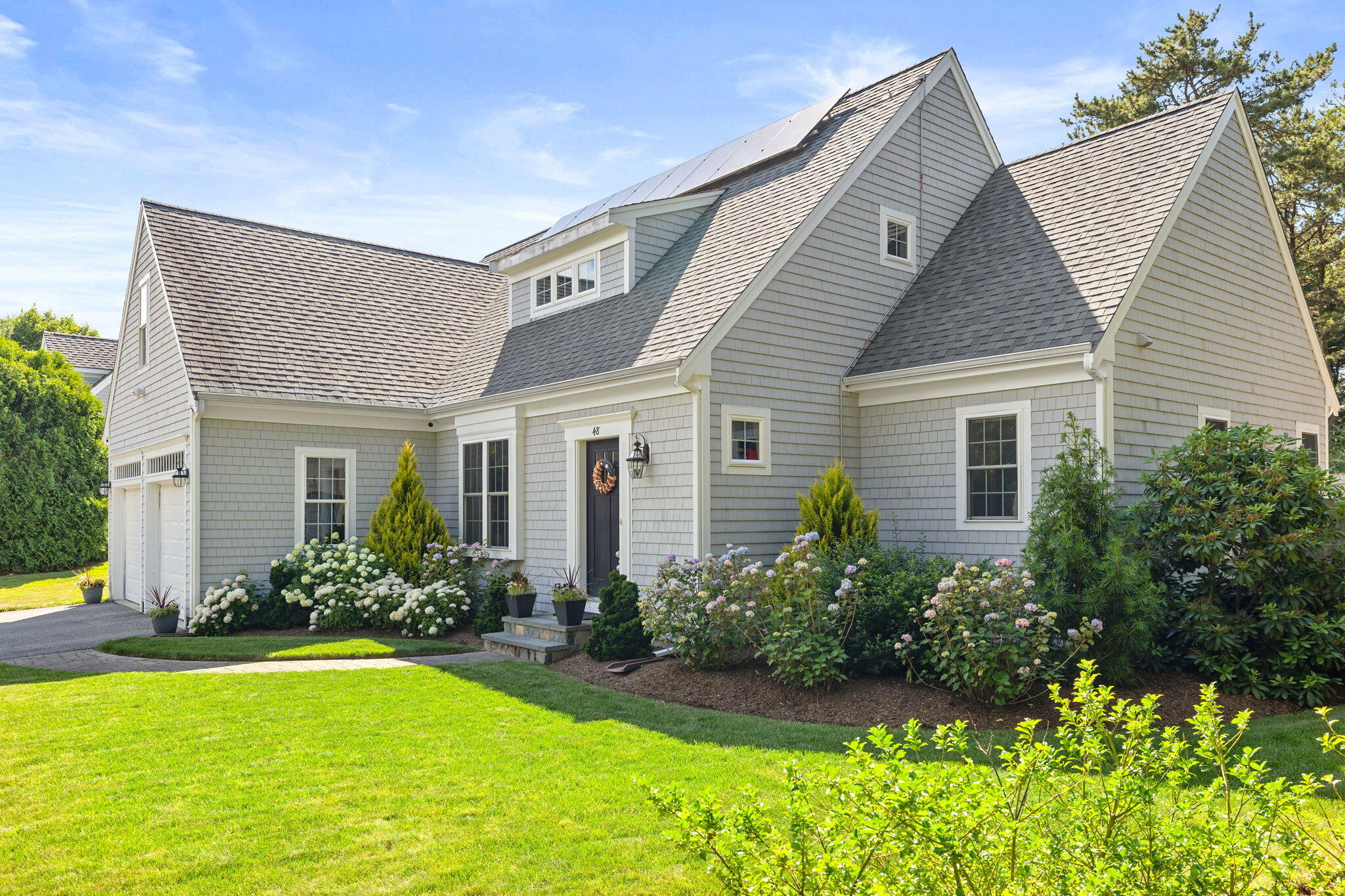 48 Meadowbrook Road Mashpee, MA 02649 - Photo 2 of 52 a front view of house with yard and green space