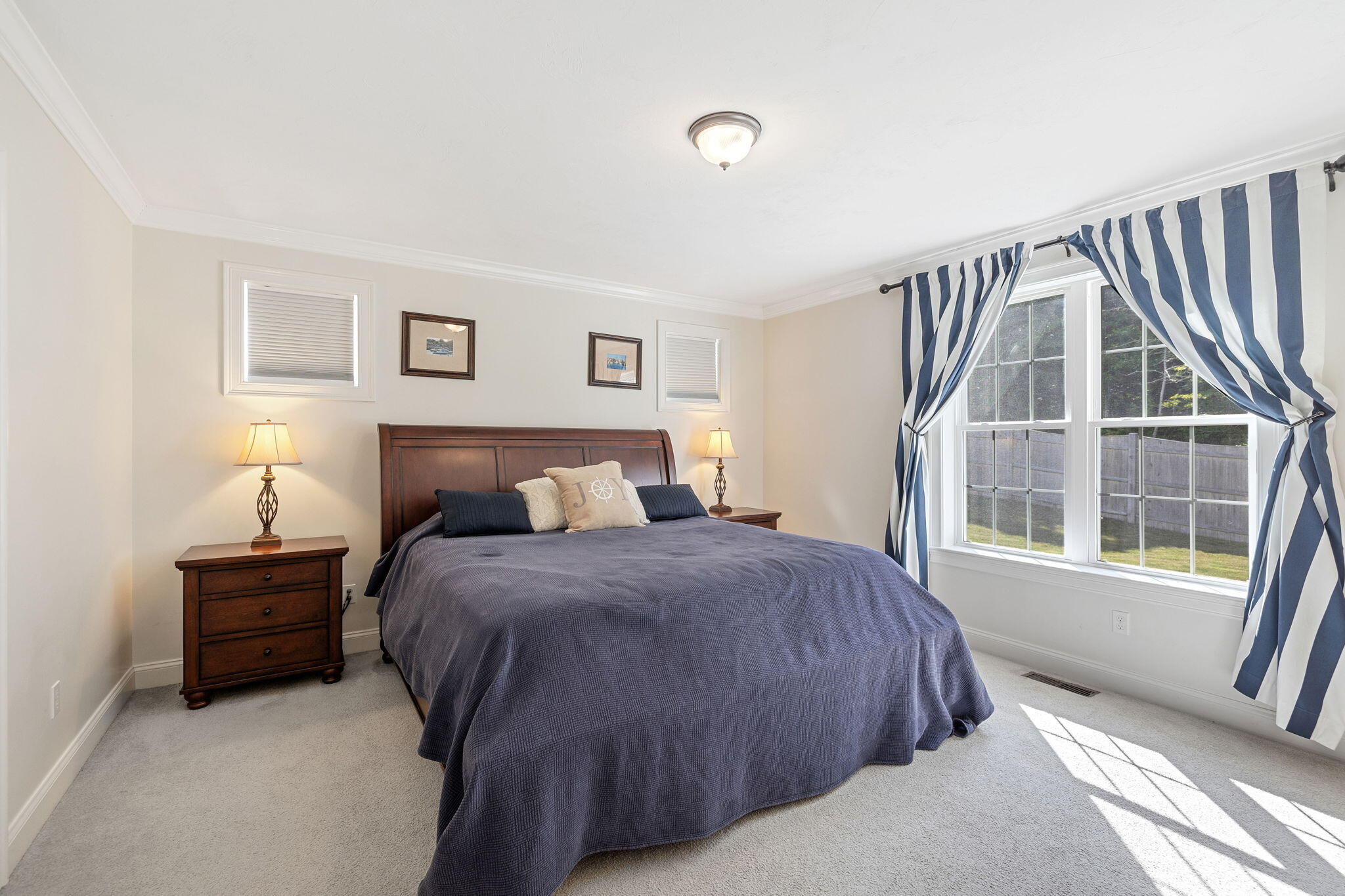 48 Meadowbrook Road Mashpee, MA 02649 - Photo 22 of 52 a bedroom with a bed and a window