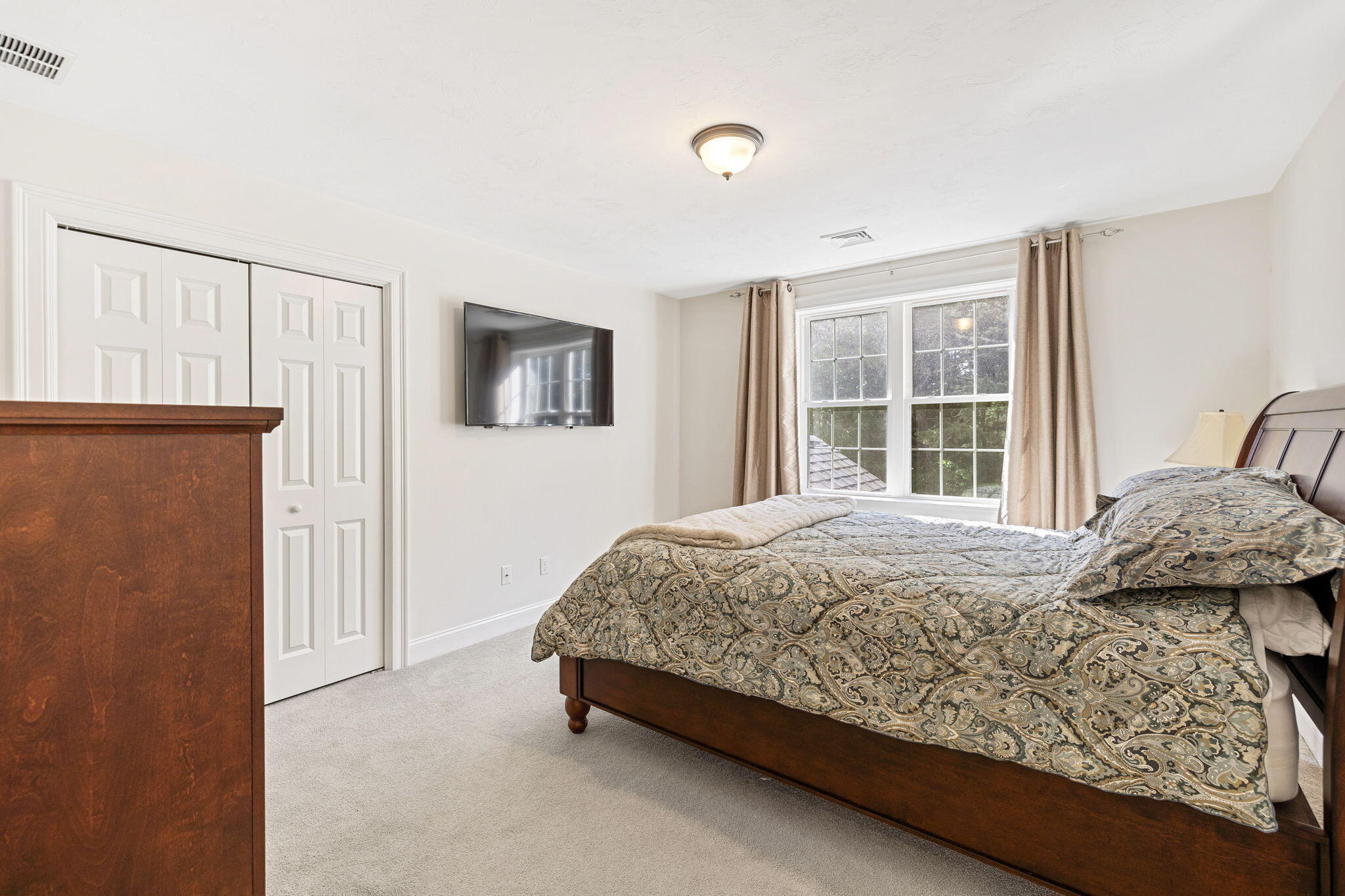 48 Meadowbrook Road Mashpee, MA 02649 - Photo 25 of 52 a bedroom with a bed and a window