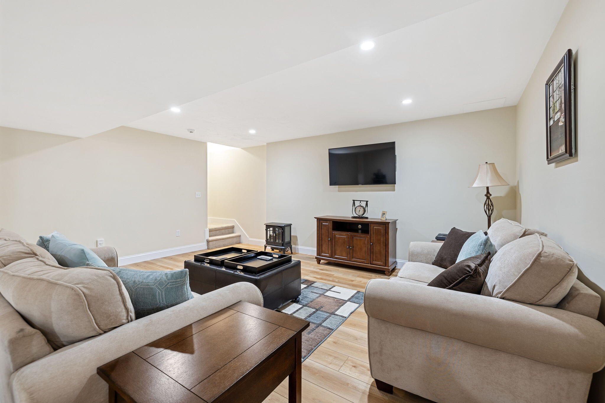 48 Meadowbrook Road Mashpee, MA 02649 - Photo 33 of 52 a living room with furniture and a flat screen tv