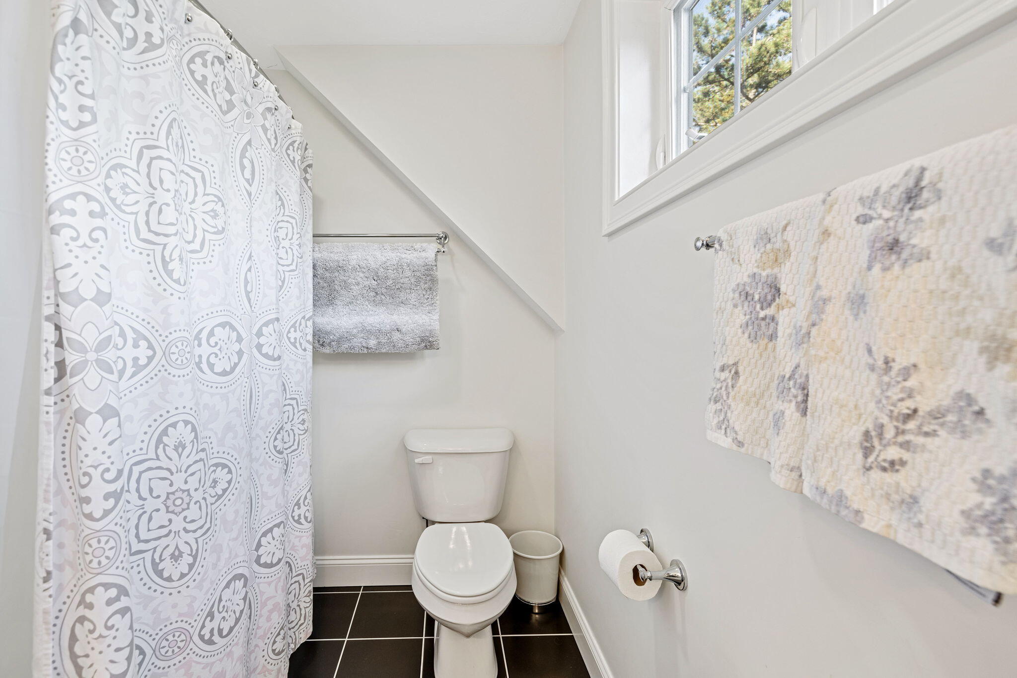 48 Meadowbrook Road Mashpee, MA 02649 - Photo 35 of 52 a white toilet sitting next to a shower curtain