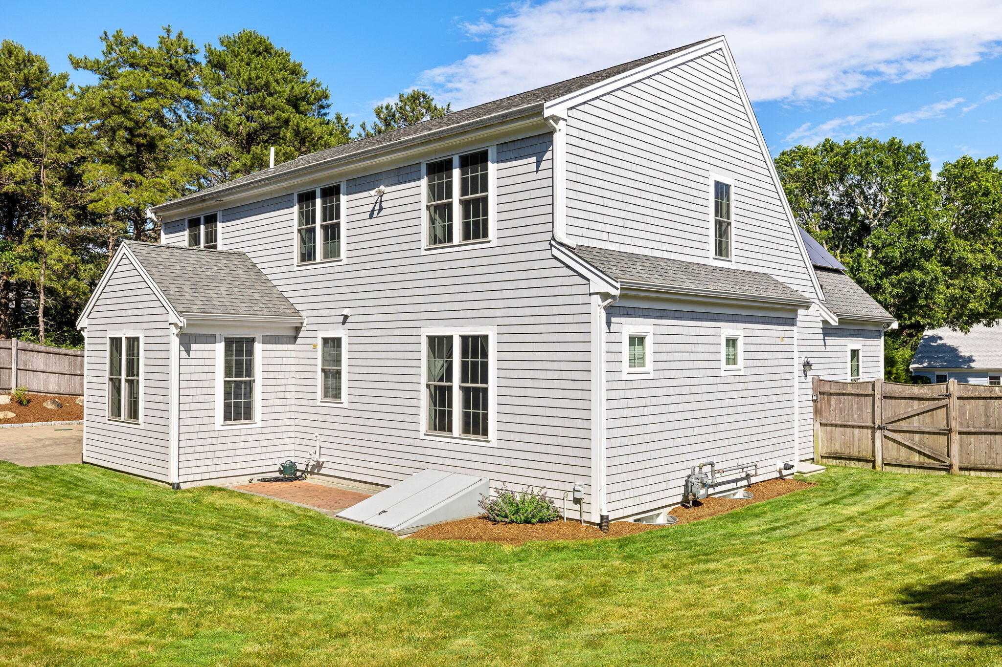 48 Meadowbrook Road Mashpee, MA 02649 - Photo 36 of 52 a front view of a house with a yard