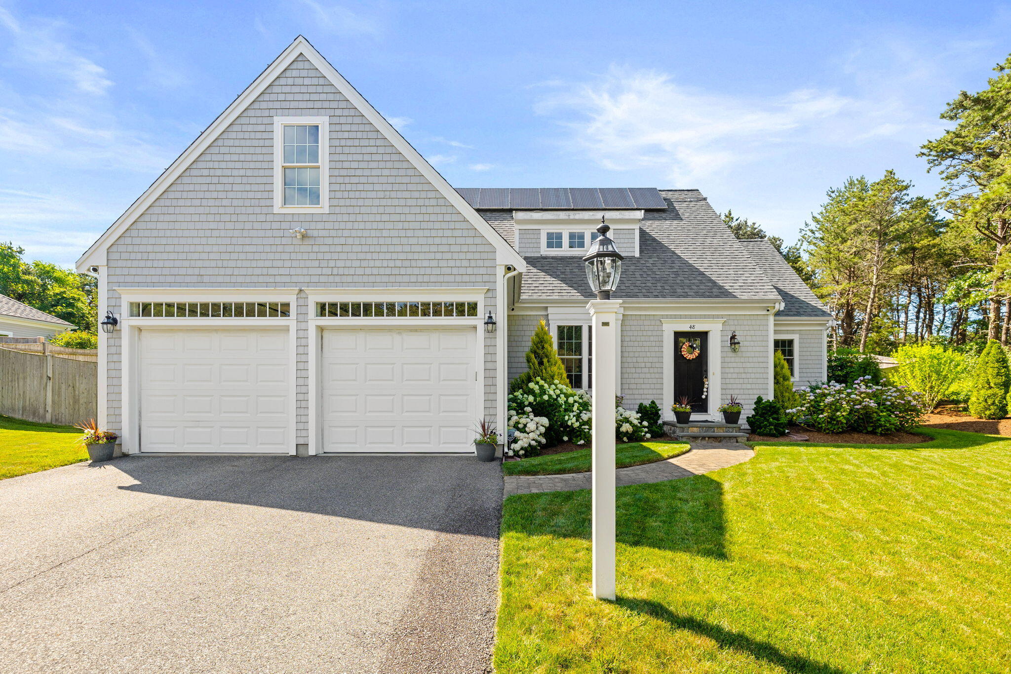 48 Meadowbrook Road Mashpee, MA 02649 - Photo 37 of 52 a view of a house with swimming pool and a yard with plants