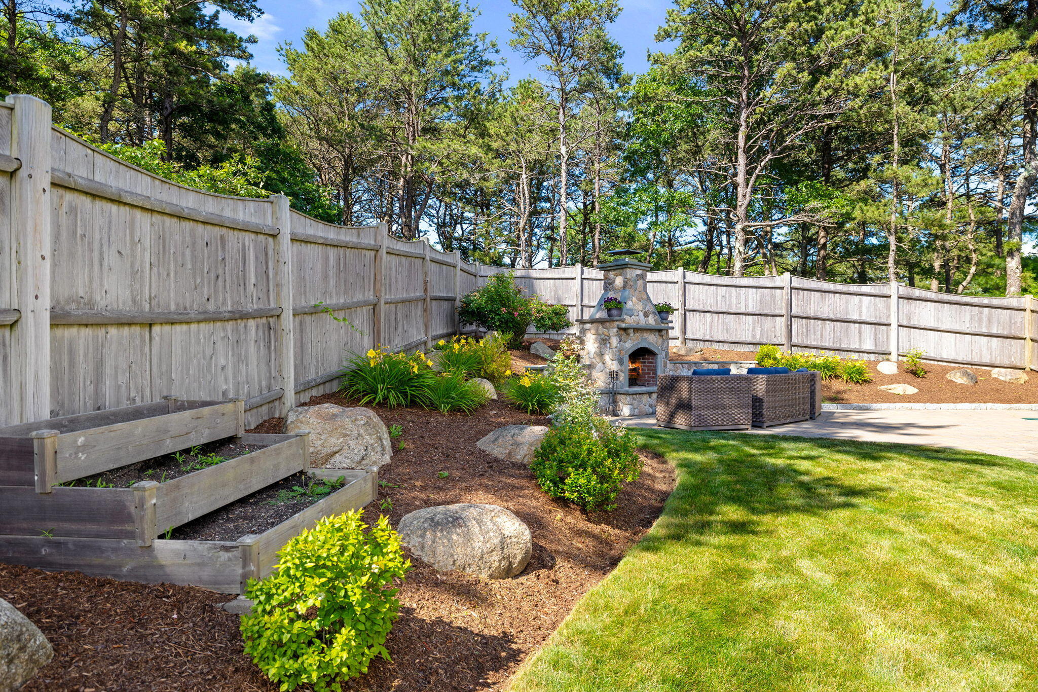 48 Meadowbrook Road Mashpee, MA 02649 - Photo 40 of 52 a view of a backyard with sitting area