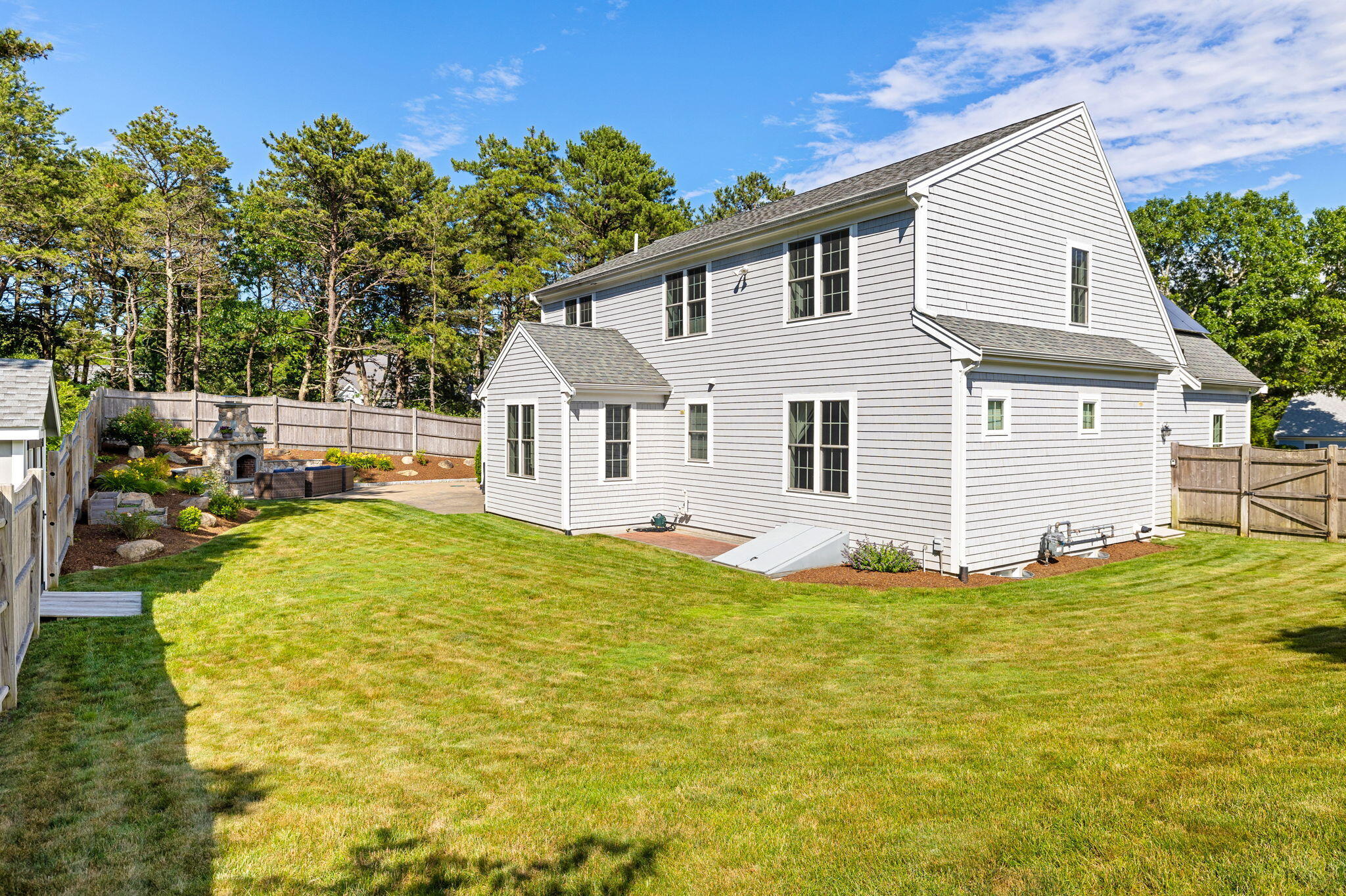 48 Meadowbrook Road Mashpee, MA 02649 - Photo 48 of 52 a view of a house with a yard