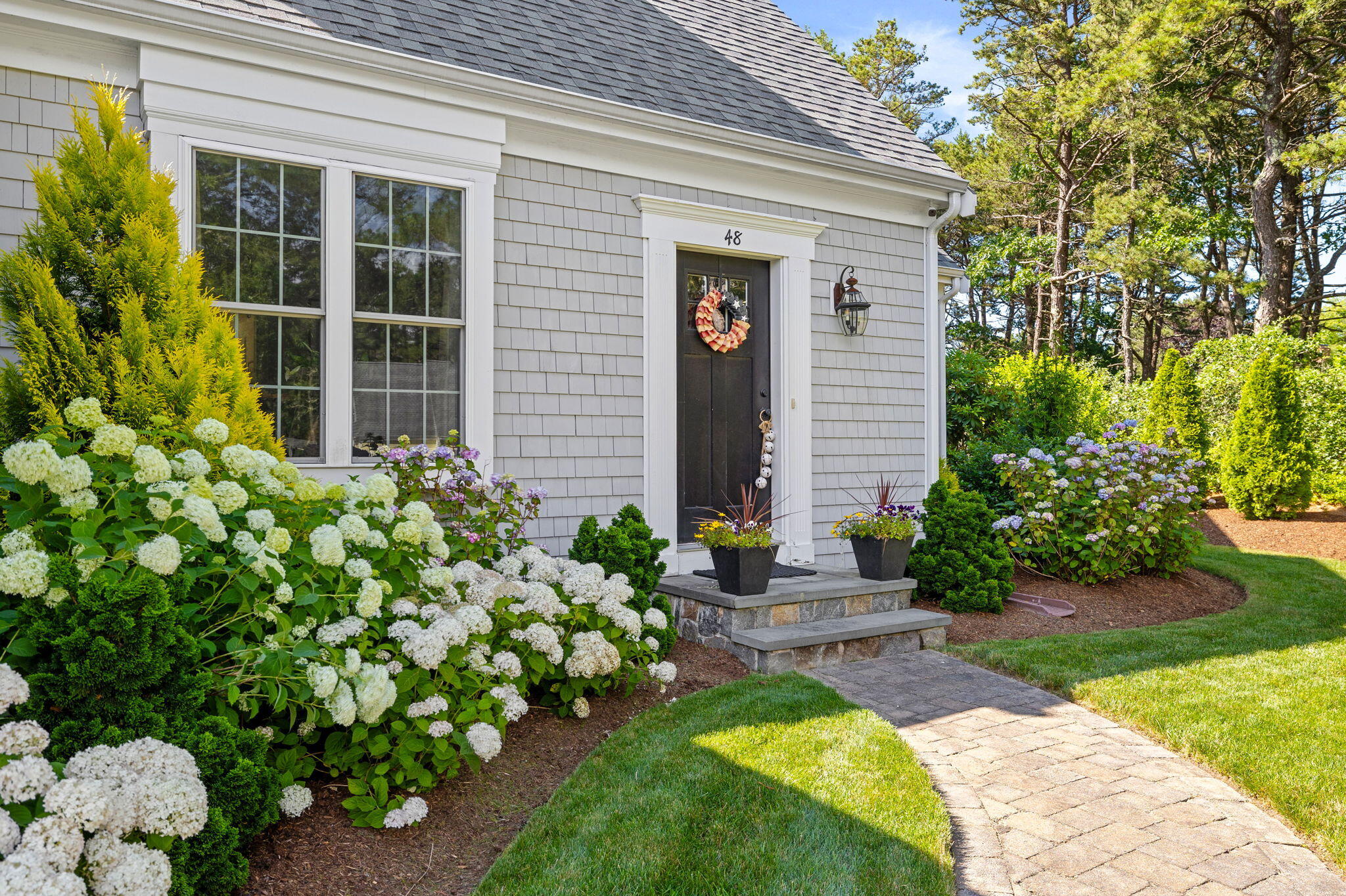 48 Meadowbrook Road Mashpee, MA 02649 - Photo 5 of 52 a front view of a house with garden