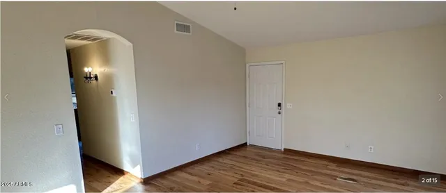 a view of a livingroom with wooden floor