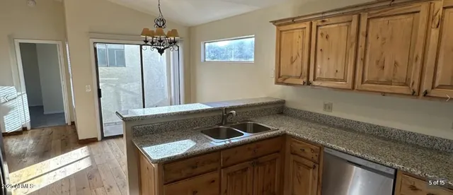 a kitchen with a sink and a window