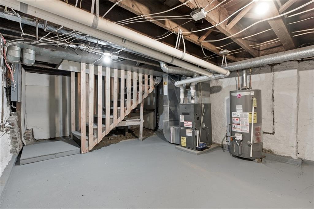 42 Cowan Street Pittsburgh, PA 15211 - Photo 26 of 27 a view of an empty room with wooden walls