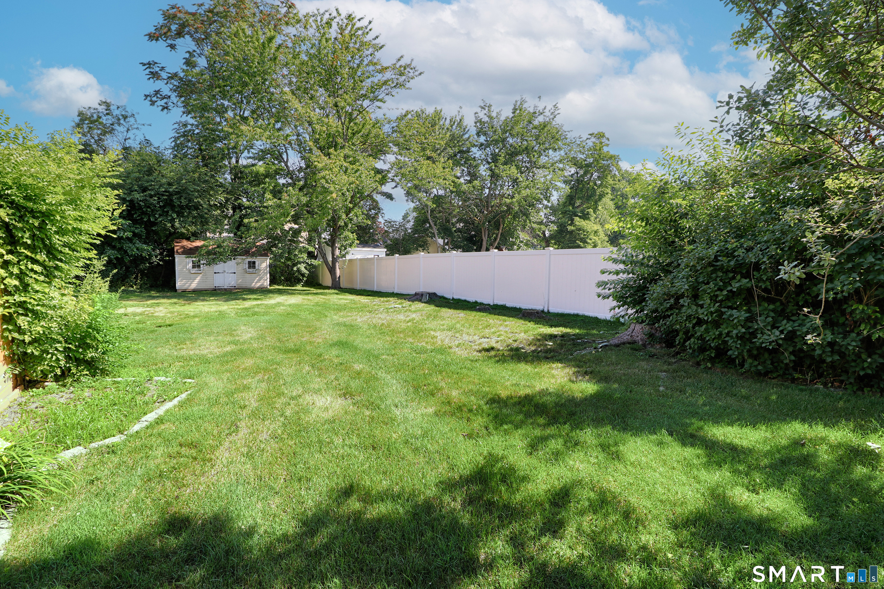 104 Henderson Road Fairfield, CT 06824 - Photo 26 of 26 Welcome to the large level and partially fenced backyard.