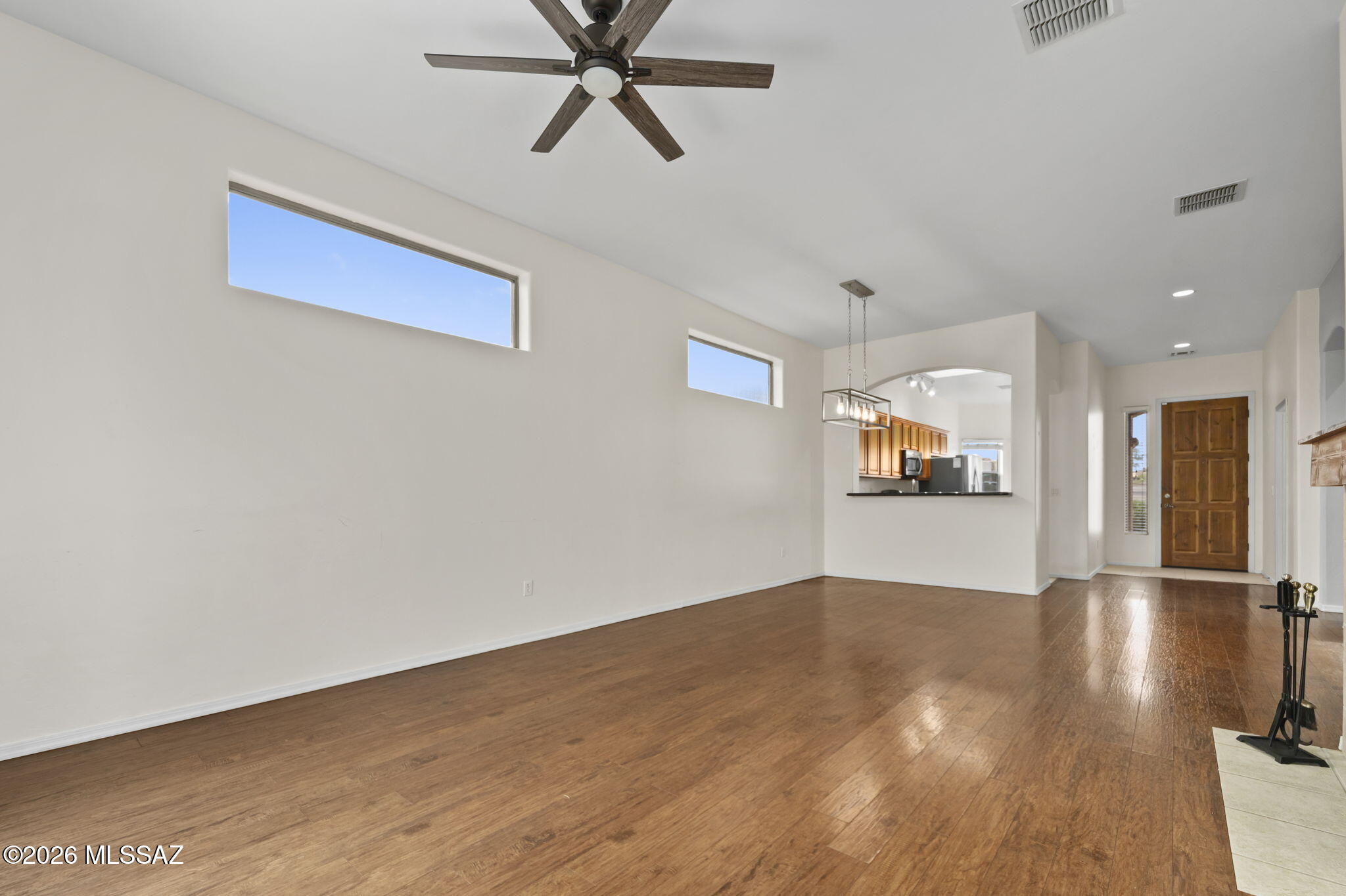 13668 East High Plains Ranch Street Vail, AZ 85641 - Photo 19 of 51 a view of empty room with wooden floor