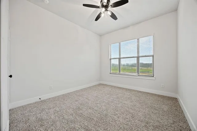 a bathroom with a sink double vanity granite and a mirror