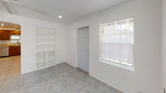 a view of an empty room with a window