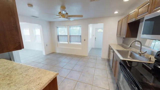 a view of kitchen with furniture and a stove