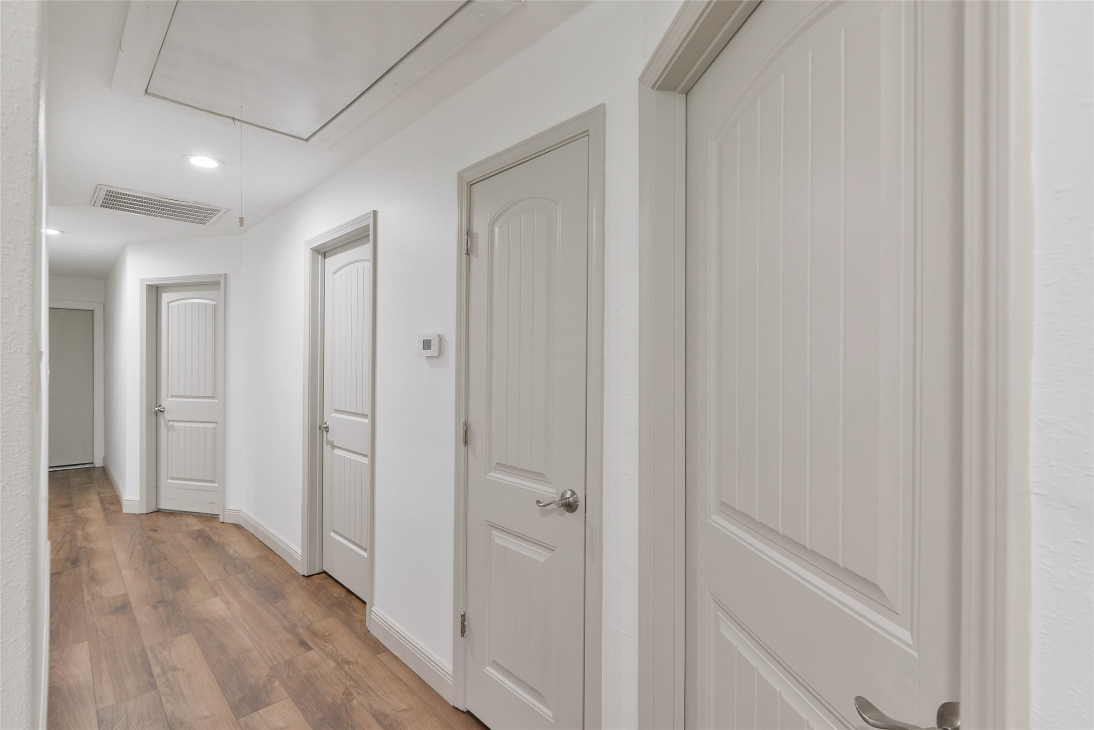 531 Brandon Road Conroe, TX 77302 - Photo 20 of 33 a view of a hallway with wooden floor