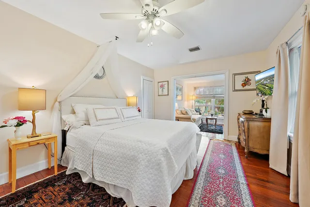 a bed room with a bed and a chandelier