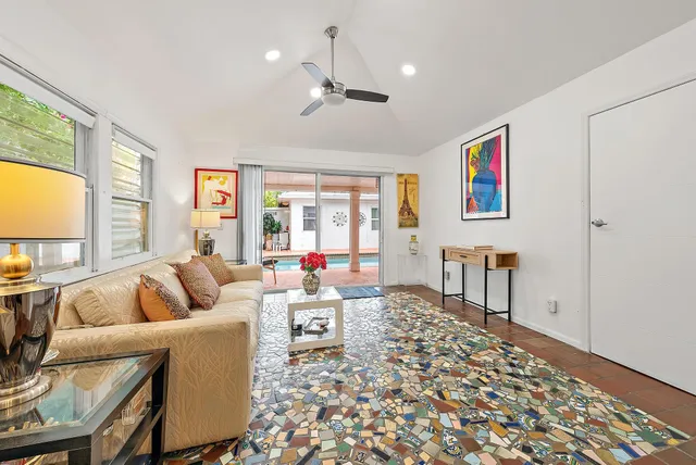 a living room with furniture and a large window