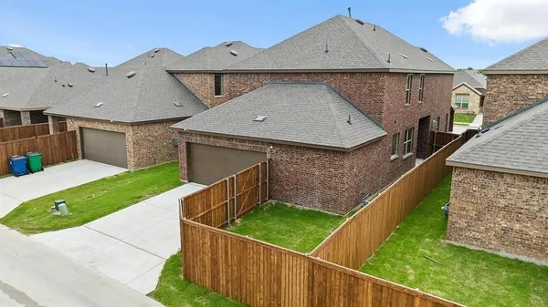 a aerial view of a house with a yard