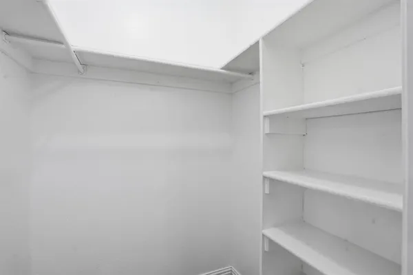 a view of an empty walk in closet