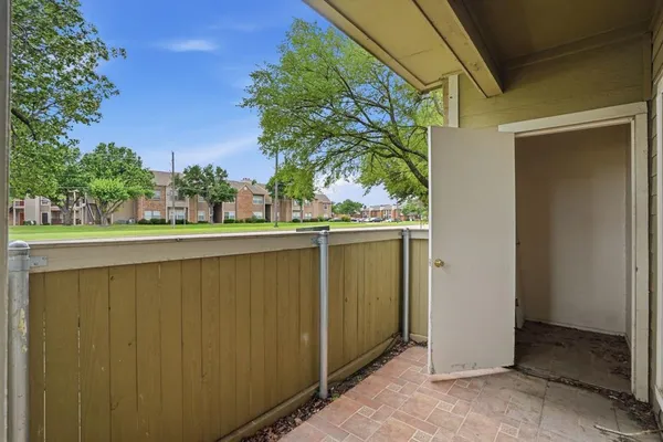 a balcony view with an outdoor space