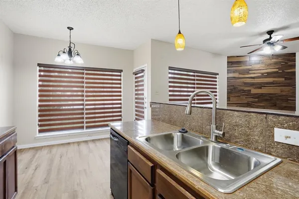 a kitchen with a sink and a window