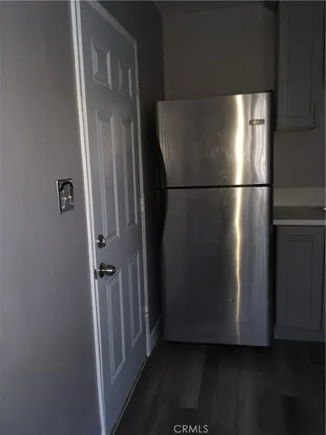 a view of a refrigerator in kitchen