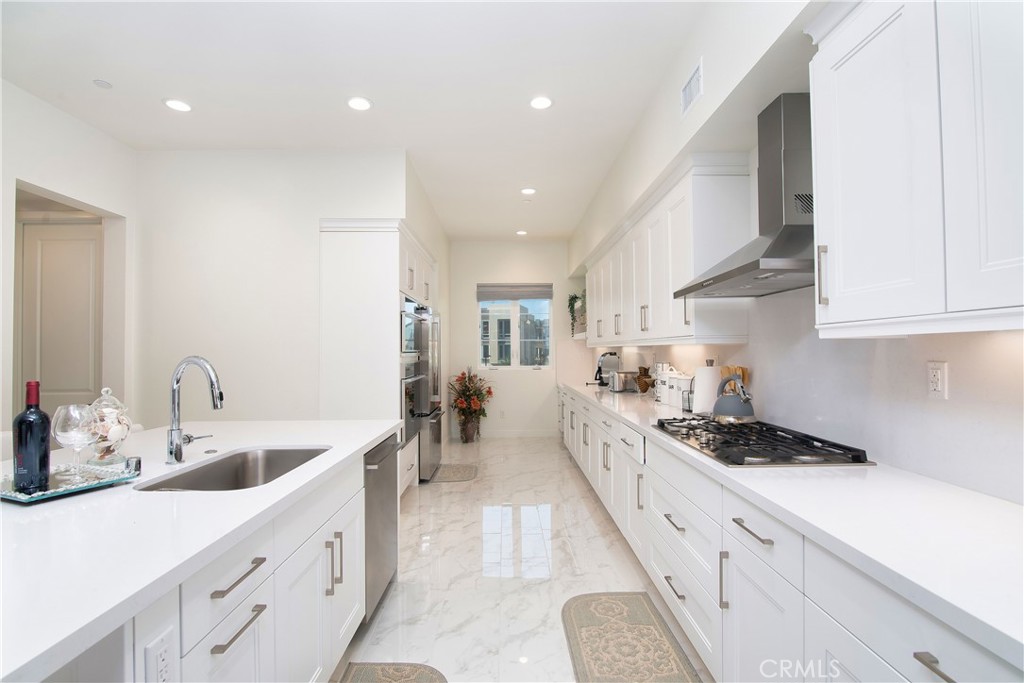 1523 Doheny Way Dana Point, CA 92629 - Photo 12 of 26 a kitchen with sink stove and cabinets